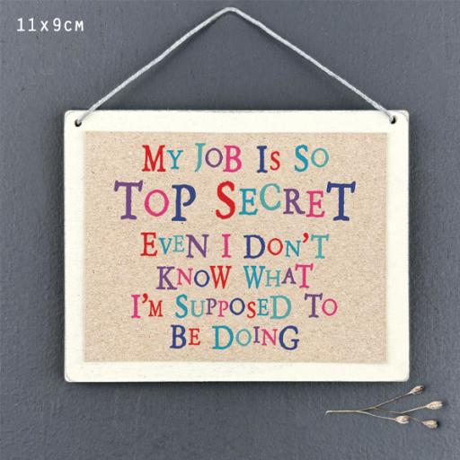 My job is so top secret even I don’t know ... hanging sign